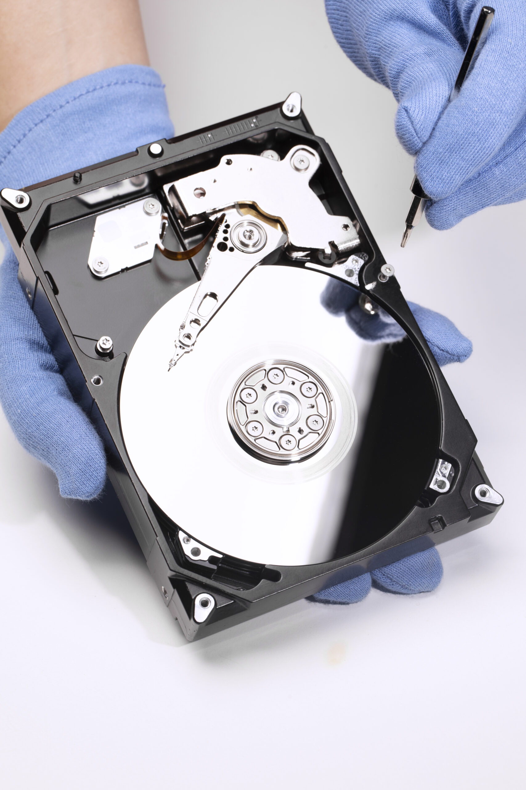 hands-repairing-hard-drive-high-angle device data recovery service