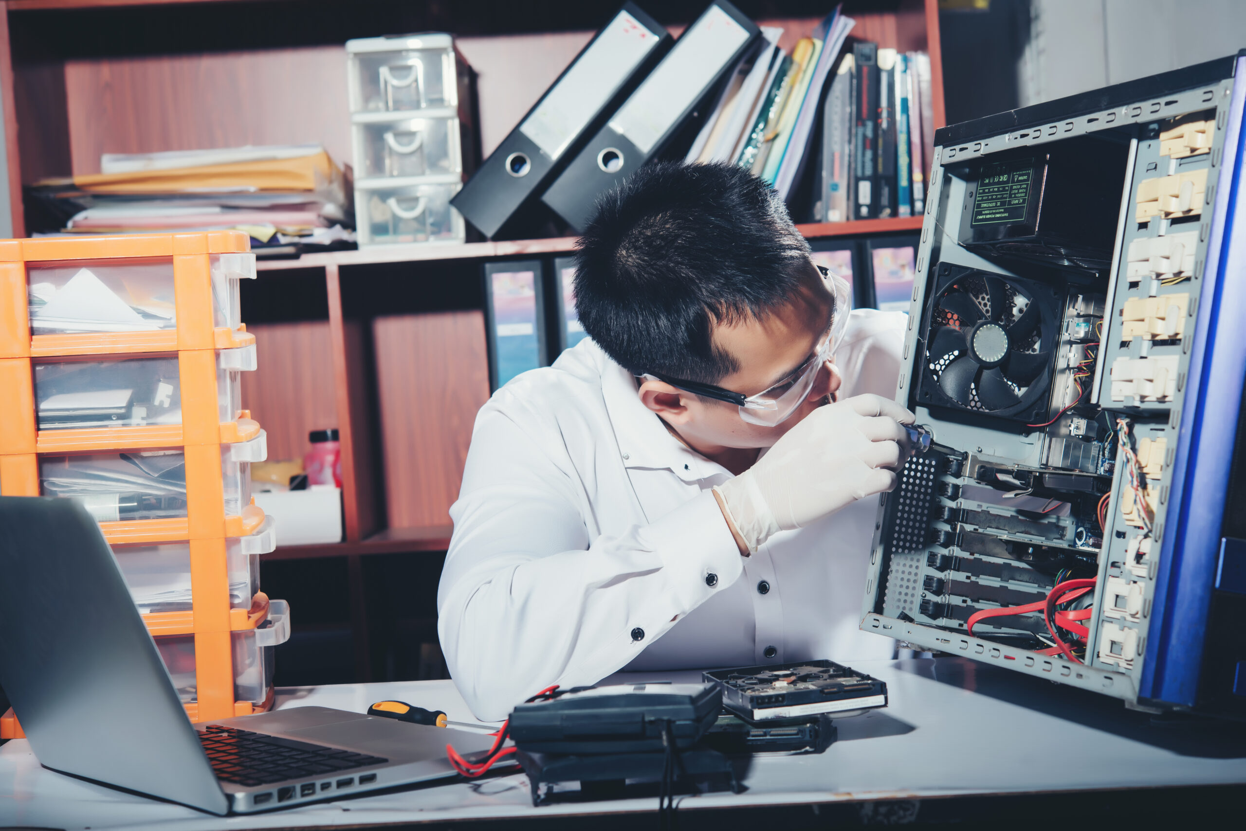 The technician repairing the computer,computer hardware, repairi repair computer Singapore